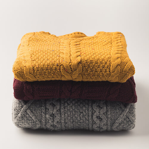 Pile Of Colourful Jumpers