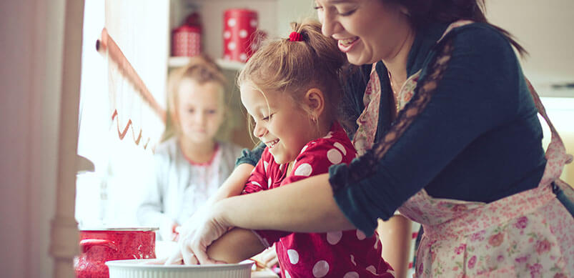 Mum And Daughter Cooking Together