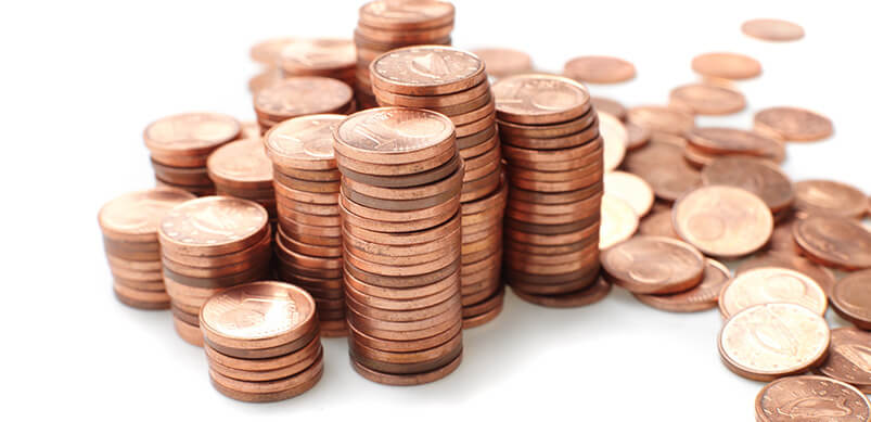 Piles Of Pennies On White Background