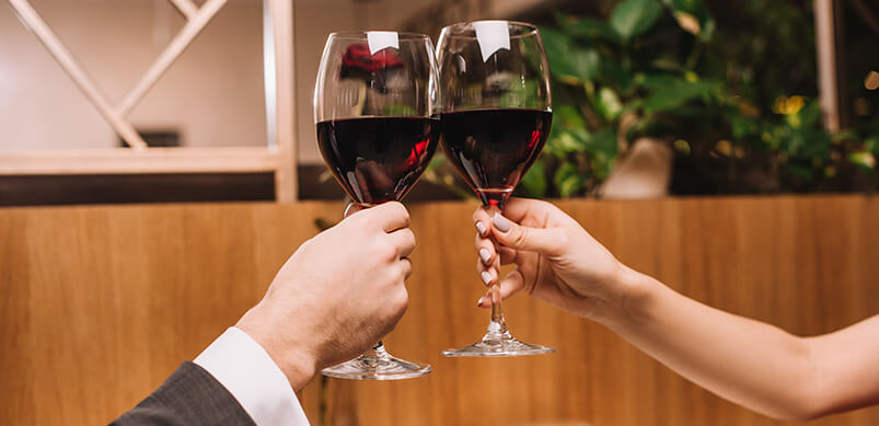 Couple Doing Cheers With Wine Glasses