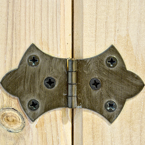 Close Up Of Door Hinge On Wooden Door