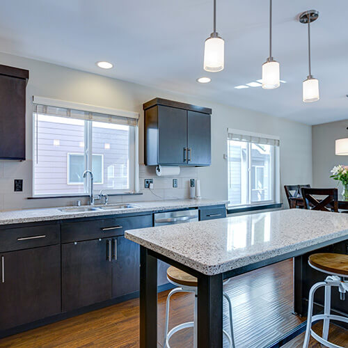 Long Lighting Hanging From Ceiling In Kitchen