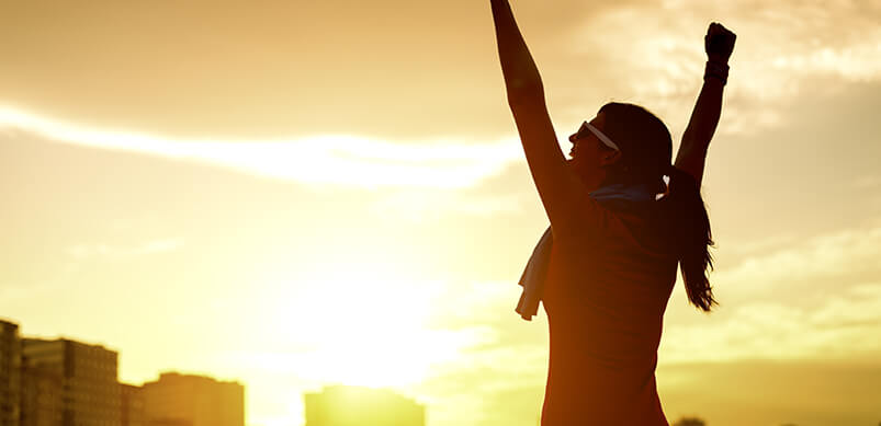 Woman Celebrating Outside At Sun Rise