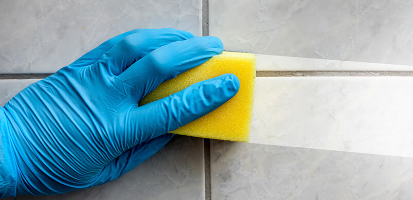 Sponge Cleaning Dirt From Tiles