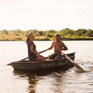 Couple In Rowing Boat On Lake