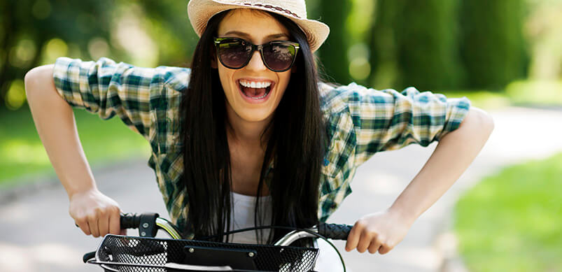 Happy Woman On Bicycle