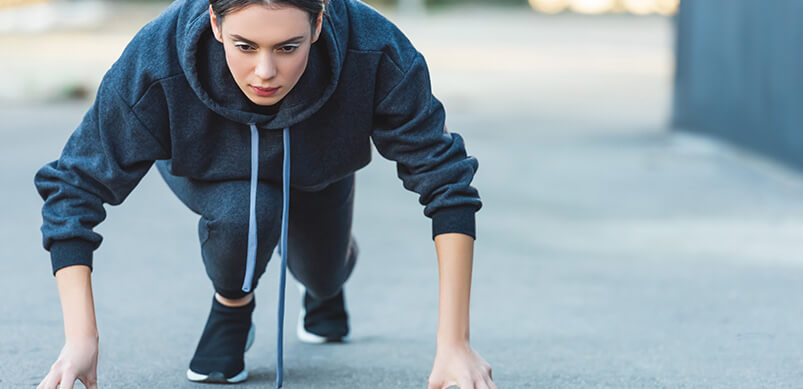 Woman Preparing To Start A Run