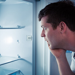 Man Looking Inside Fridge