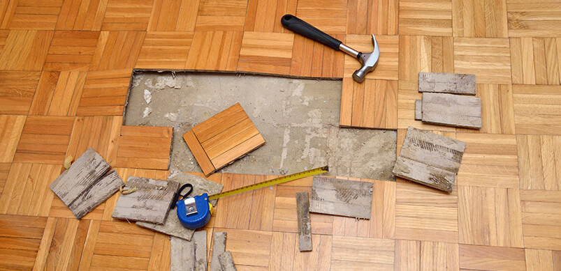 Broken Floor Tiles With Hammer