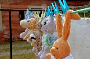 Cuddly toys on washing line