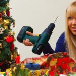 Woman on phone with Christmas tree and drill