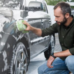 Man Cleaning Car