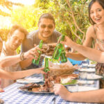 Family And Dog Around Barbecue Food