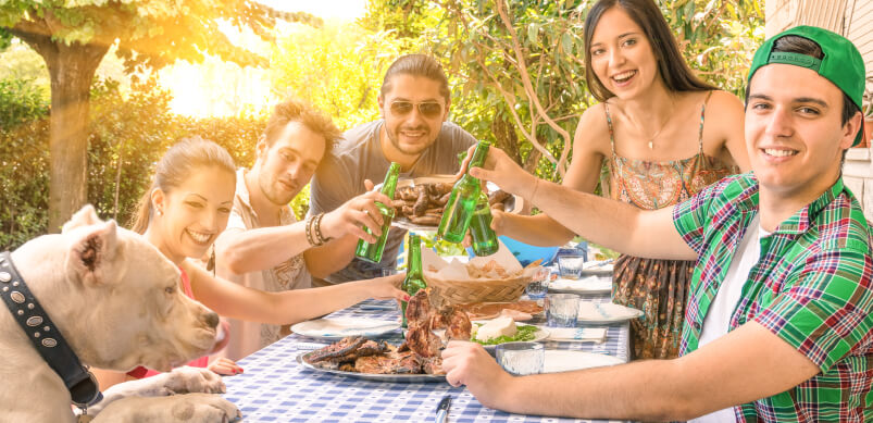 Family And Dog Around Barbecue Food