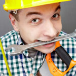 Man Smiling Holding DIY Tools