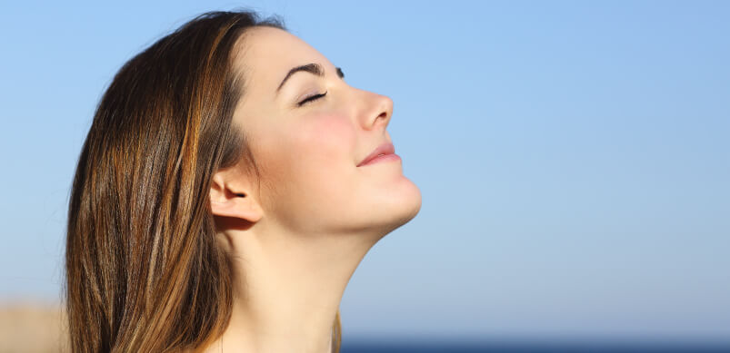 Woman Practising Deep Breathing