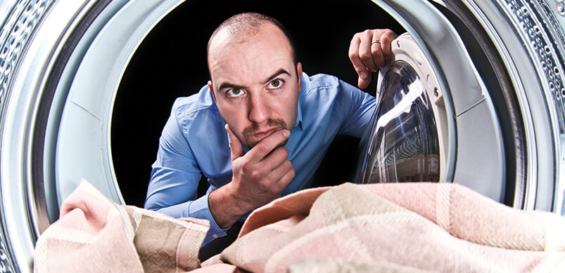 Man Looking Inside Washing Machine 