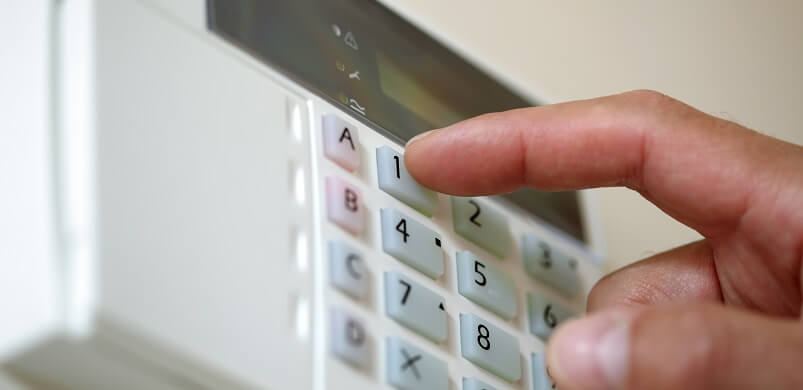 Person Setting House Alarm