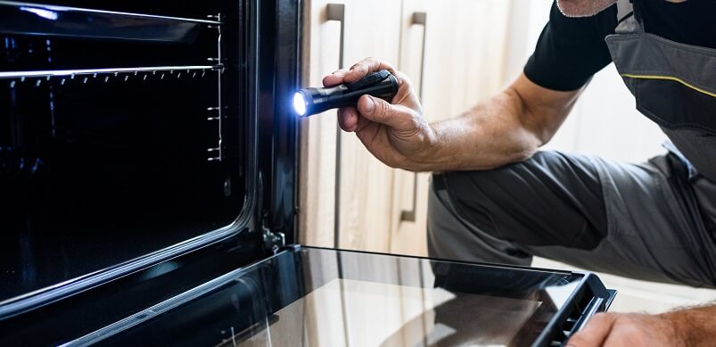 Man looking Inside Oven