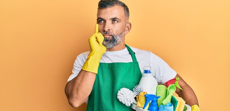 Man Thinking Holding Cleaning Equipment