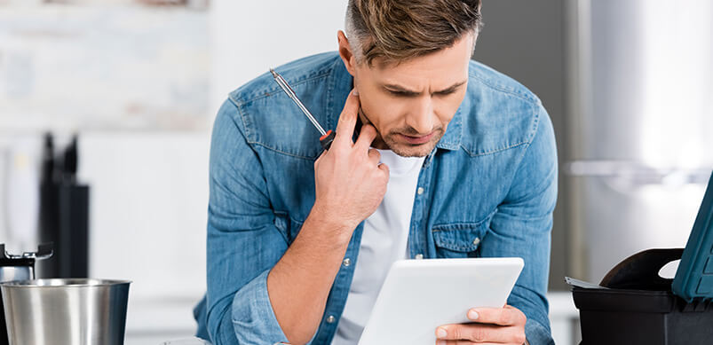 Man Reading Fixing Instructions