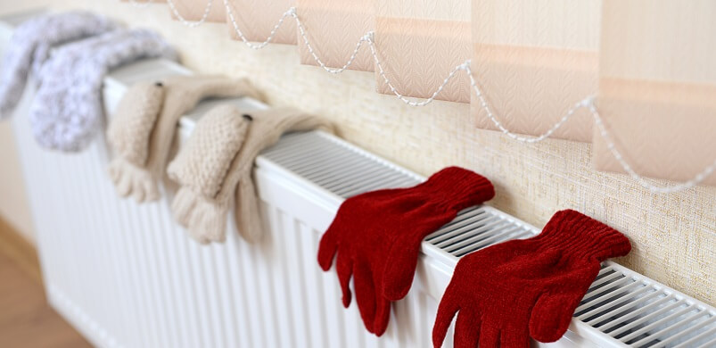 Gloves Drying on Heating Radiator