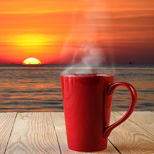 Sunrise And Coffee Cup