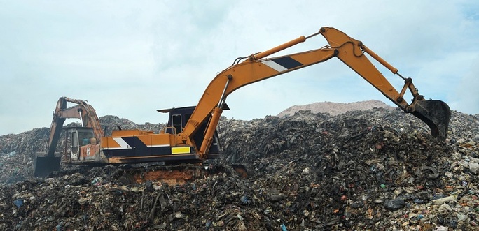 Digger In Landfill Site