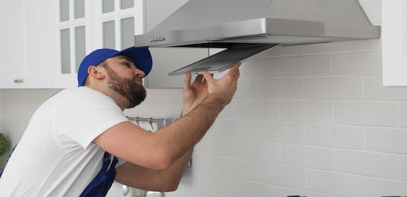 Man Checking Cooker Hood Filter