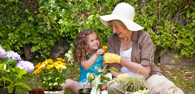 Woman and child gardening together