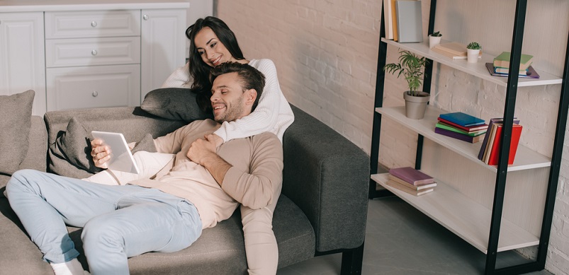 Couple relaxing on sofa