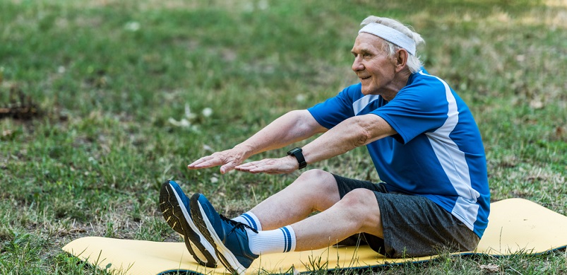 Elderly man exercising the in park